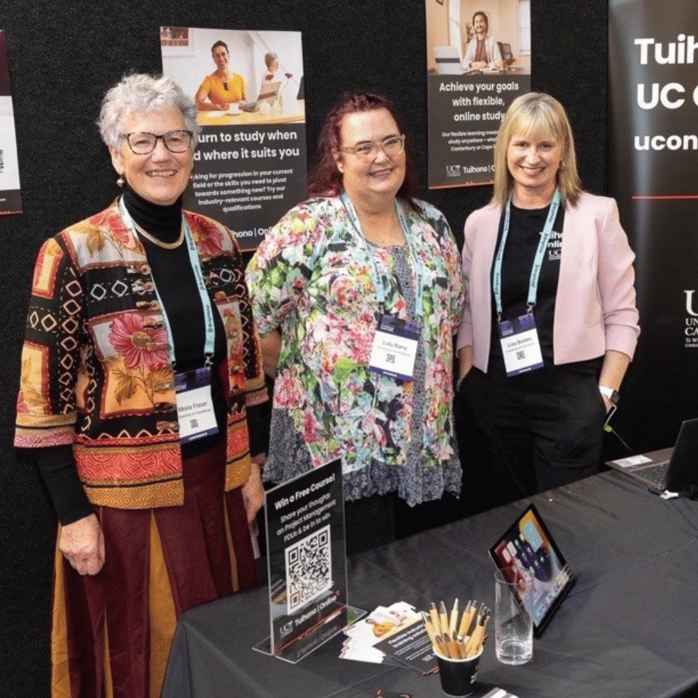 Moira Fraser, Lulu Barry and Lisa Burdes showcasing Tuihono UC | UC Online at the PMINZ 2025 Conference