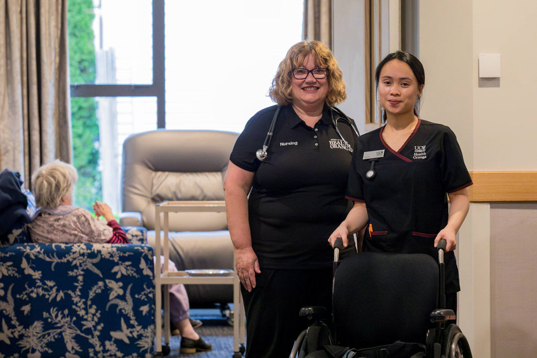 UC Faculty of Health Executive Dean Cathy Andrew works with health providers to provide clinical placements for Master of Health Sciences (Nursing) students, including current student Leianne Roblete (right).