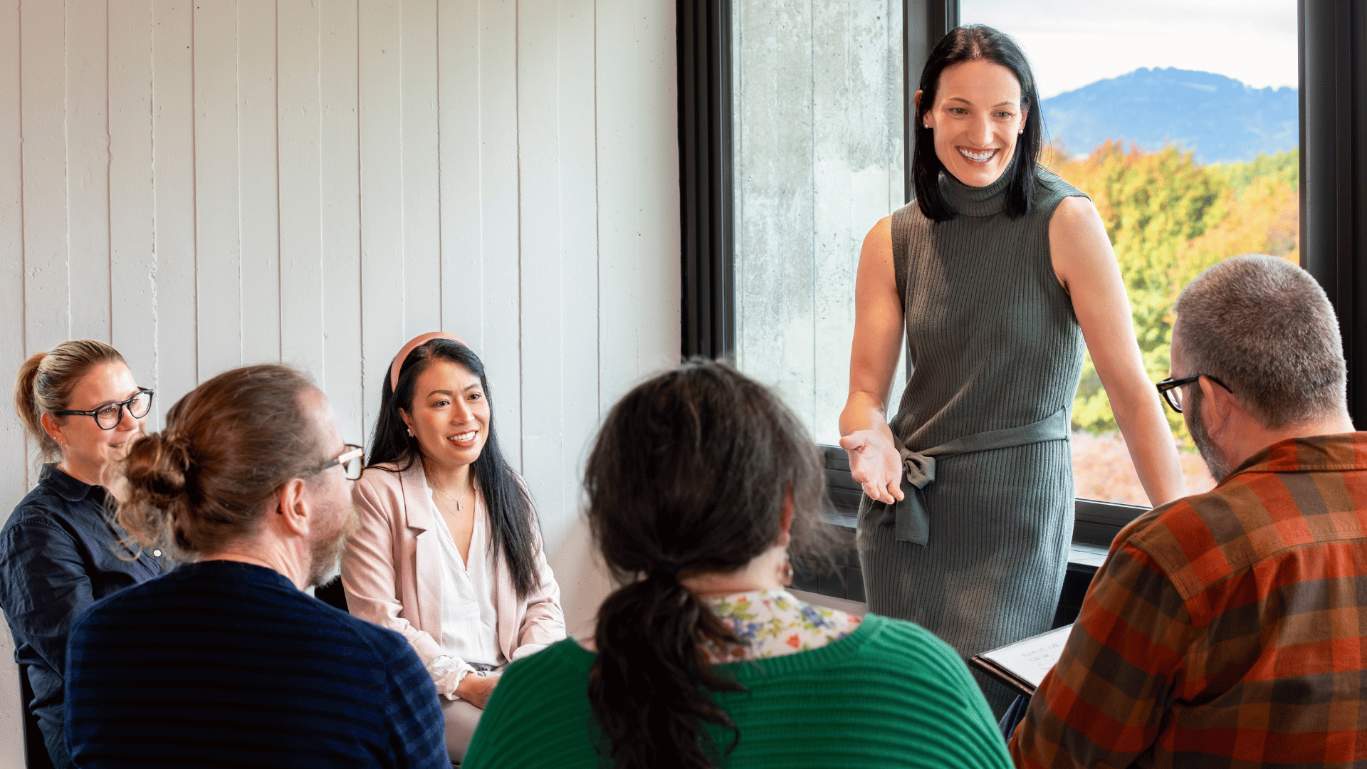 A group of people discussing careers for change in an office space.
