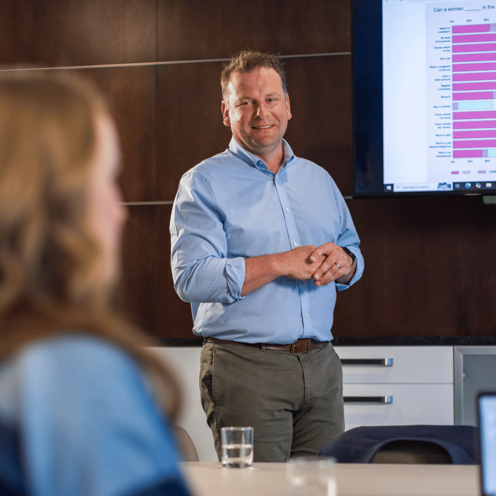 Data professional explores data ethics issues in the boardroom with his staff. 