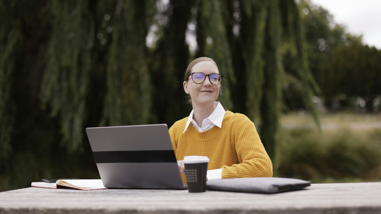 Educator smiling as she uses her new mentoring skills from Tuihono UC | UC Online education courses online.