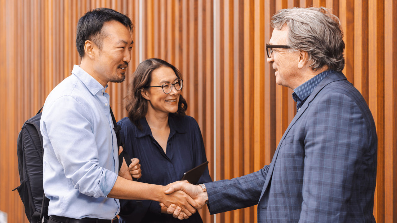 Three engineering managers discussing their engineering projects