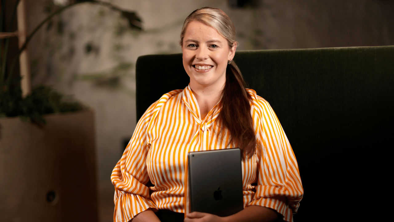 Smiling woman in yellow and white striped shirt working in the justice sector after graduating from Tuihono UC | UC Online