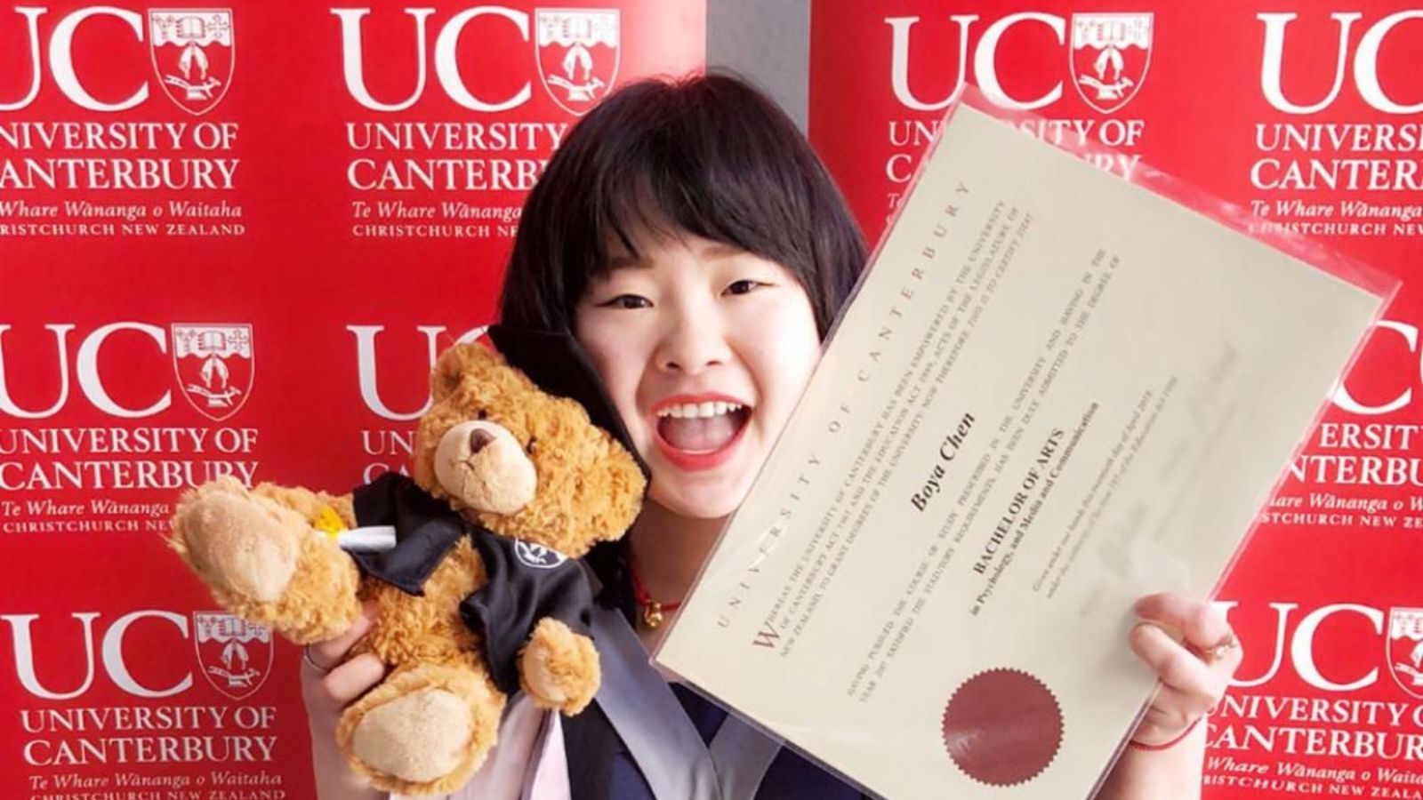 A UC Online student sits in a relaxed position on the couch, laptop on his lap, enjoying the flexibility of online learning.