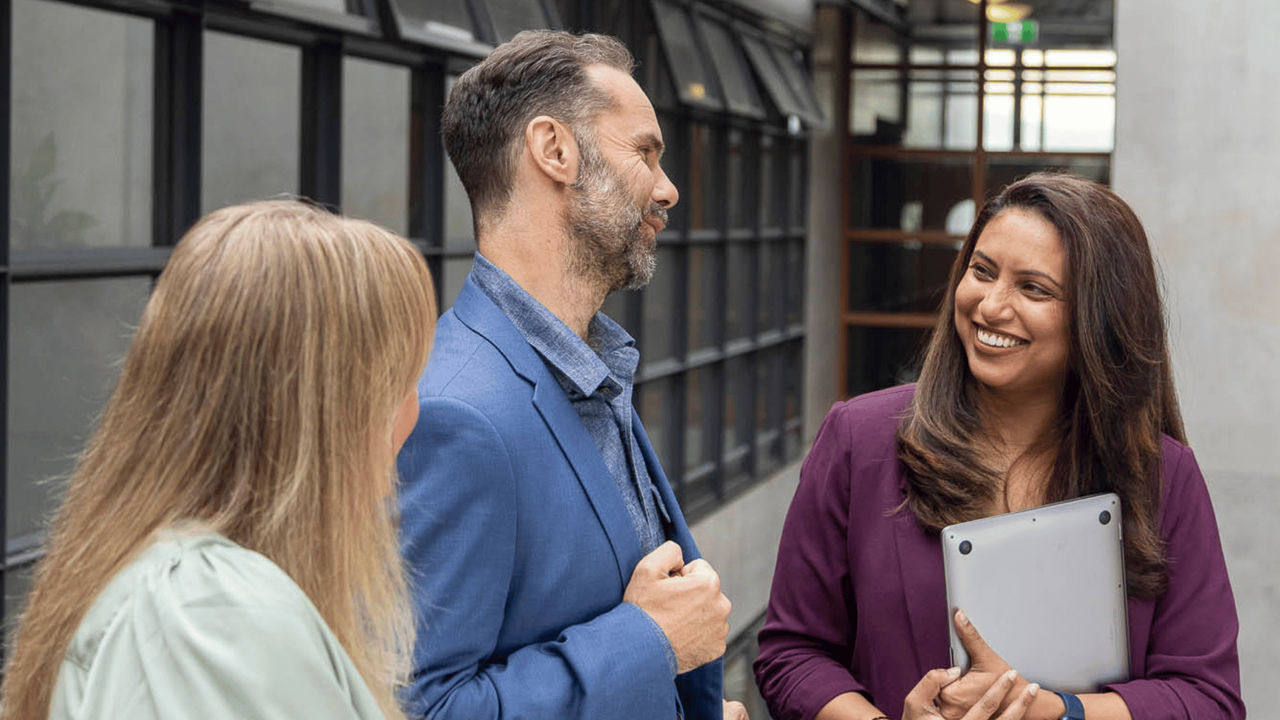 Three engineering managers discussing their engineering projects