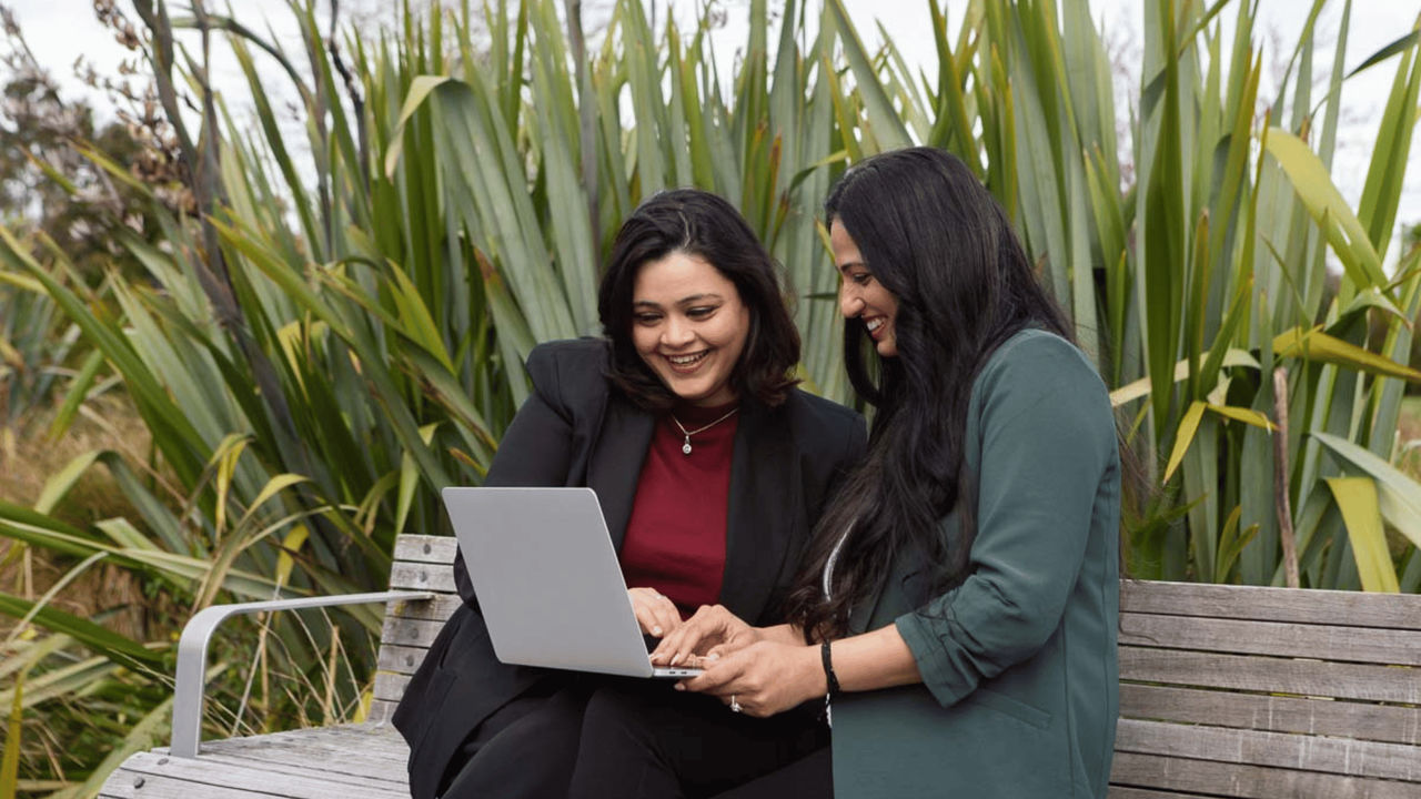 Two women studying towards their Master of Sustainable Futures and Innovation outside, learning with Tuihono UC | UC Online