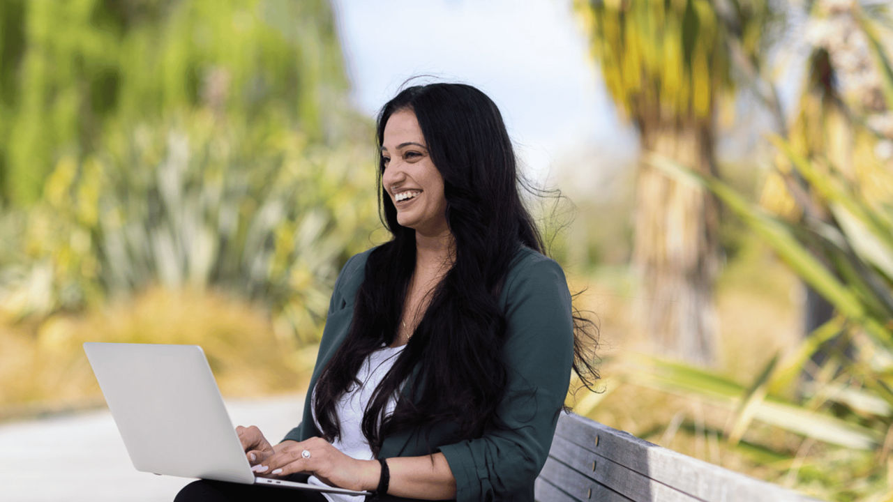 Female student studying sustainability online, viewing assignment on disruptive practices
