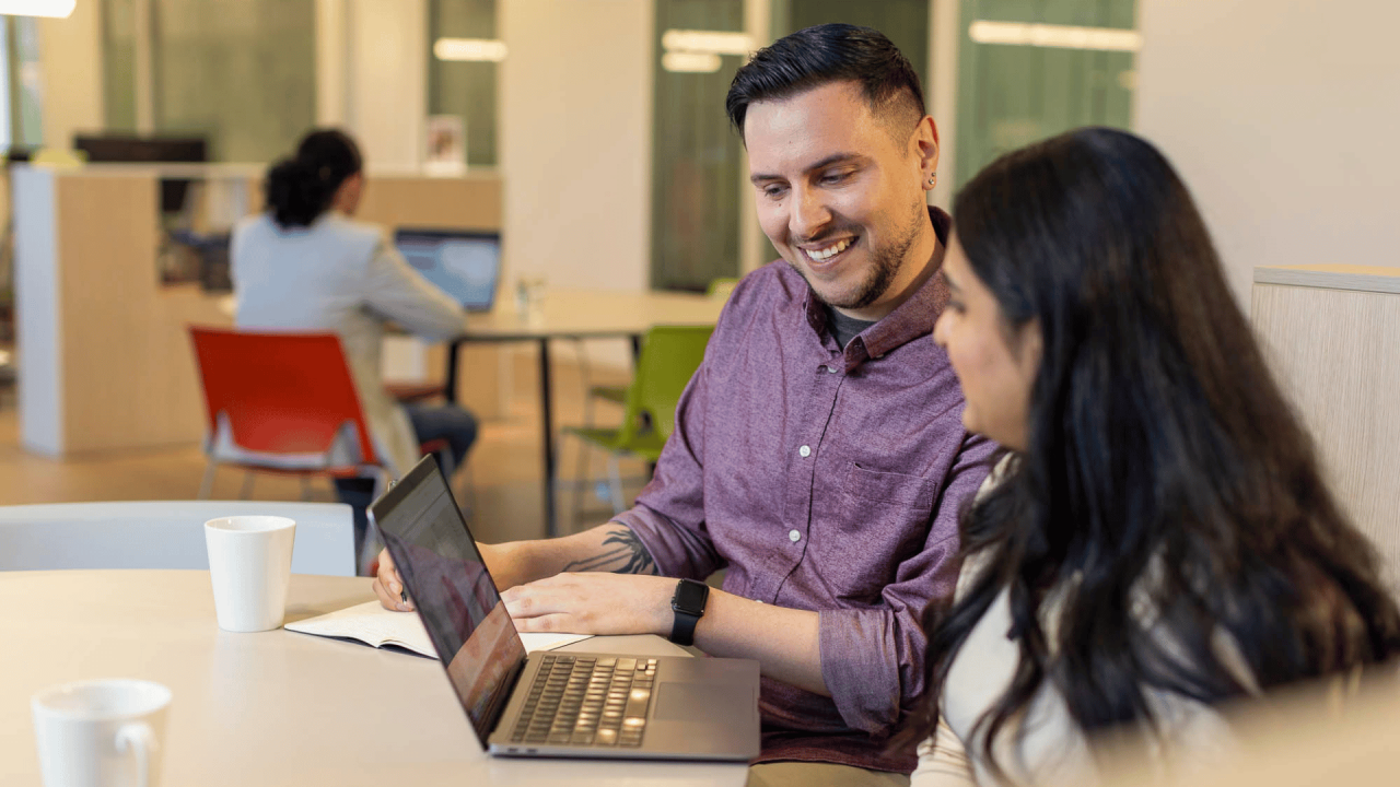 Male online enrolment advisor supporting a learner picking her 2027 courses.