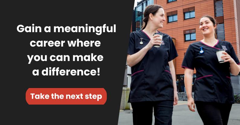 Two UC Online nursing students walk through hospital grounds, carrying takeaway coffee cups and having a cheerful conversation.